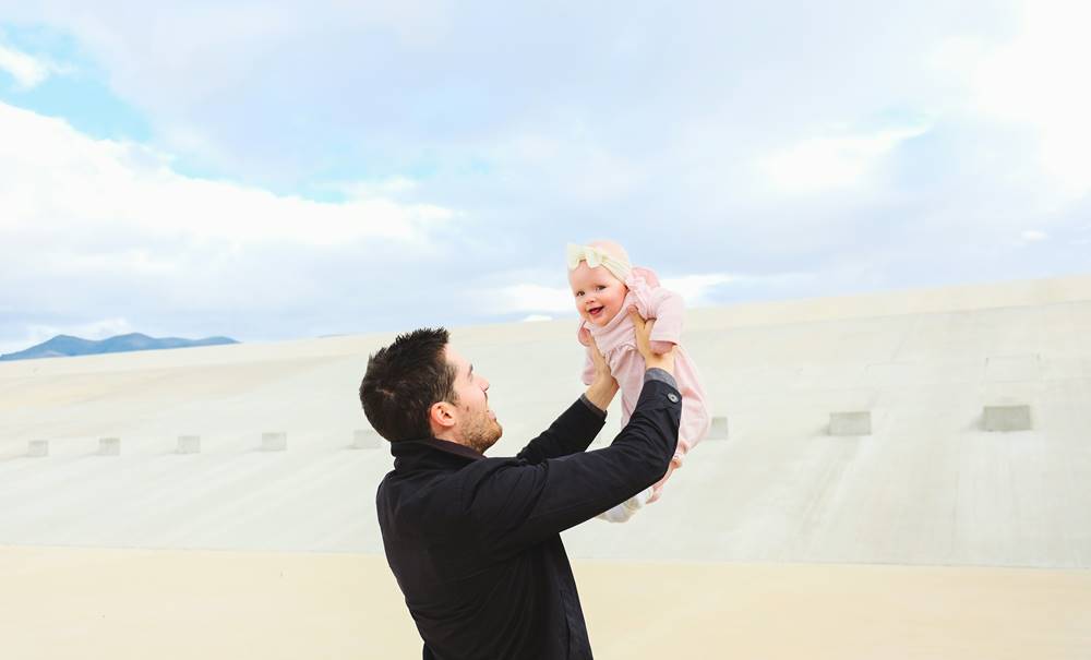 parenting father holding his daughter happy time